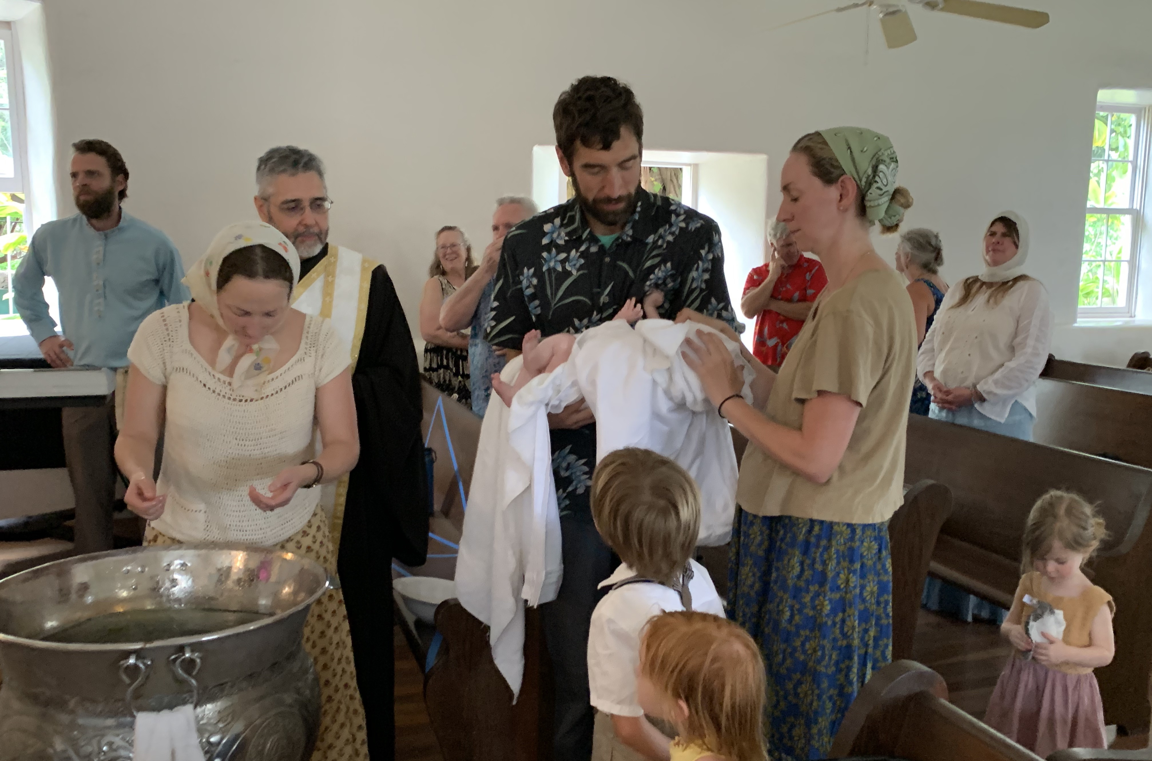 Father and Mother with Baptized Child